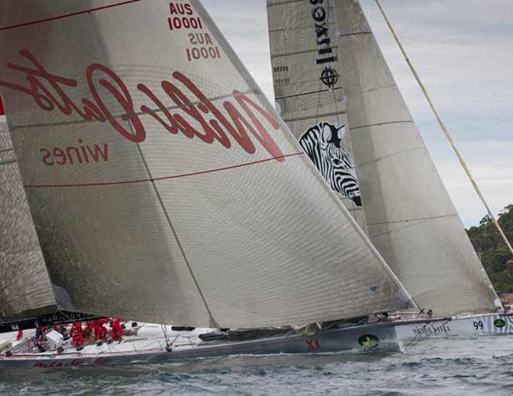 Investec LOYAL and Wild Oats XI neck and neck up the harbour