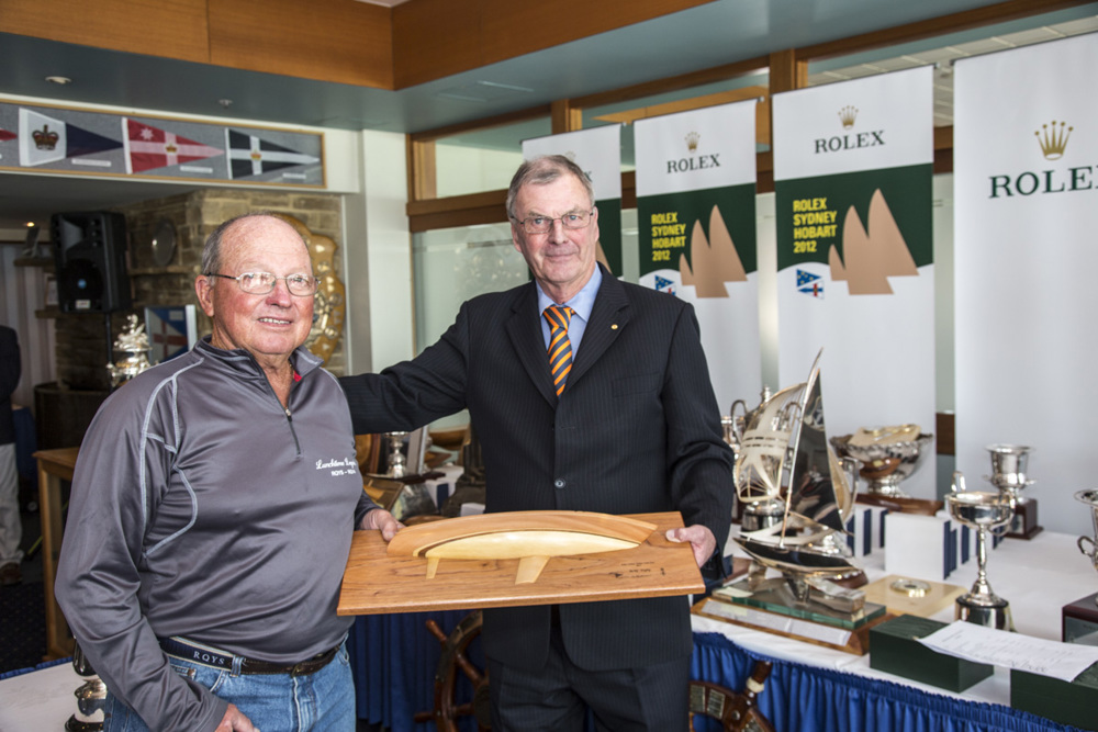 Robbo Robertson accepts the RORC trophy - 1st IRC Division 3, from Peter Underwood AC, the Governor of Tasmania