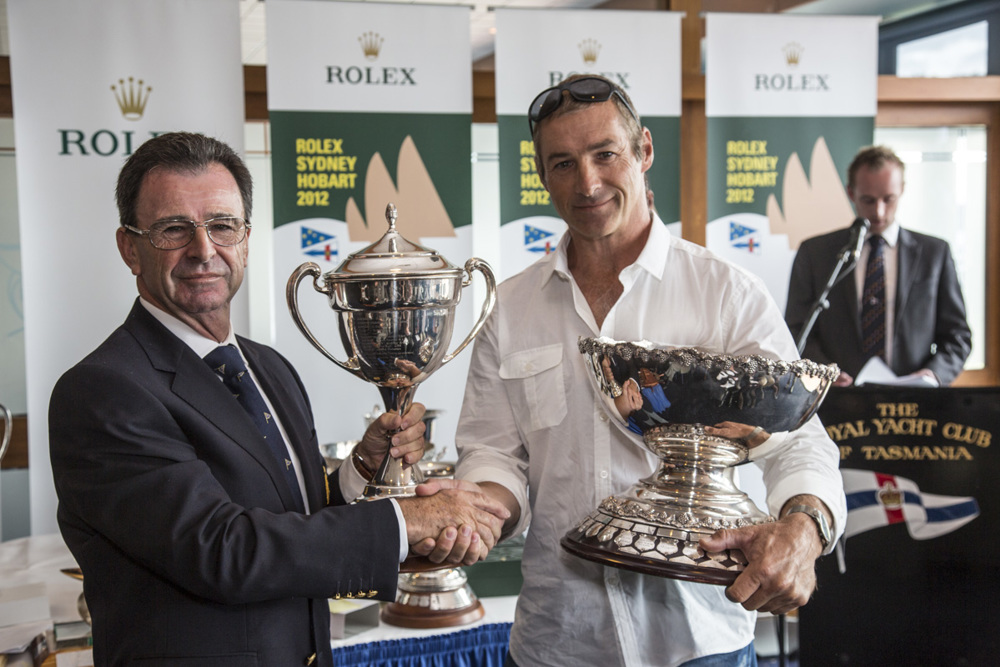 Gordon Maguire, Loki's Sailing master, accepts the George Barton Trophy (1st IRC Div 1) and City of Hobart Trophy (2nd overall IRC) and Bass Strait Cup