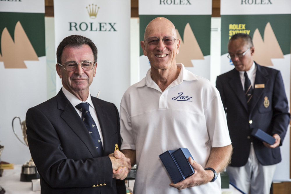 Chris Bull, owner Jazz, accepts the RORC trophy (2nd ORCi Div 1) from CYCA Commodore Howard Piggott