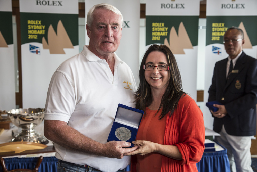 Lindsay May collects his 40 Hobart medallion from the Hon. Michelle O'Byrne