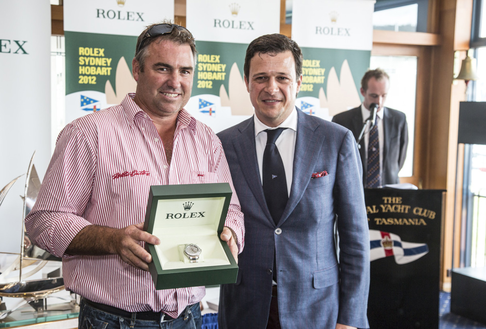 John Hildebrand, Wild Oats XI, is presented with the Rolex Yacht-Master by Patrick Boutellier, General Manager, Rolex Australia