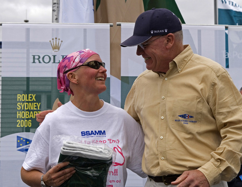 Michele Colenso, owner of Capriccio of Rhu, receiving the division winners flag from Commodore Geoff Lavis