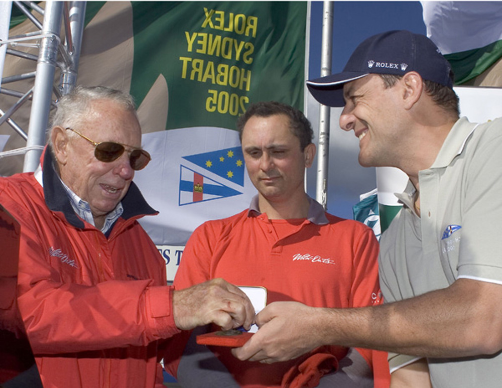 Matteo Mazzanti from Rolex SA presents a line honours medallion to Bob Oatley