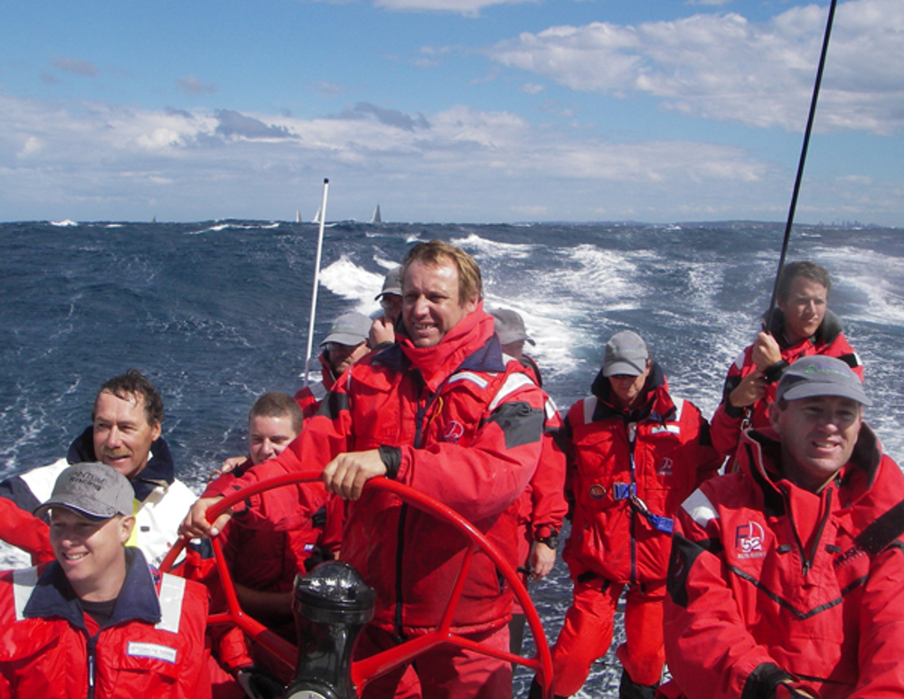Barney Walker (helm) and owner of Quantum Racing, Ray Roberts (front right) on Day 2 of the Sydney Gold Coast