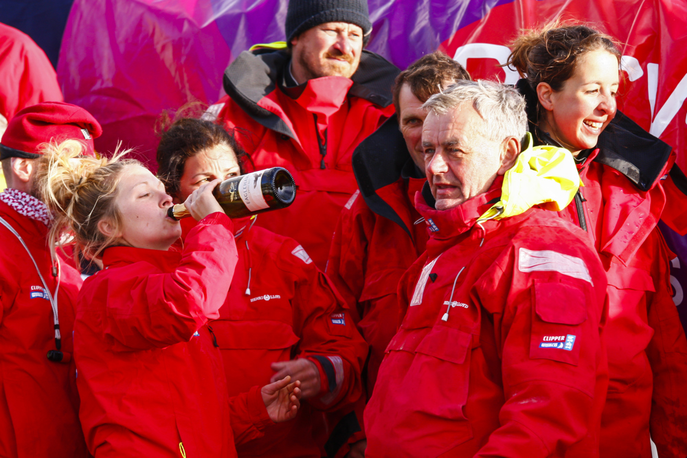 The crew of Derry~Londonderry~Doire celebrate being the first to sail up the Derwent river as a part of the Clipper Round the World race, a category of the Sydney to Hobart yacht race at Constitution Dock in Hobart, Monday, Dec. 30, 2013. (AAP Image/Heath Holden) NO ARCHIVING, EDITORIAL USE ONLY