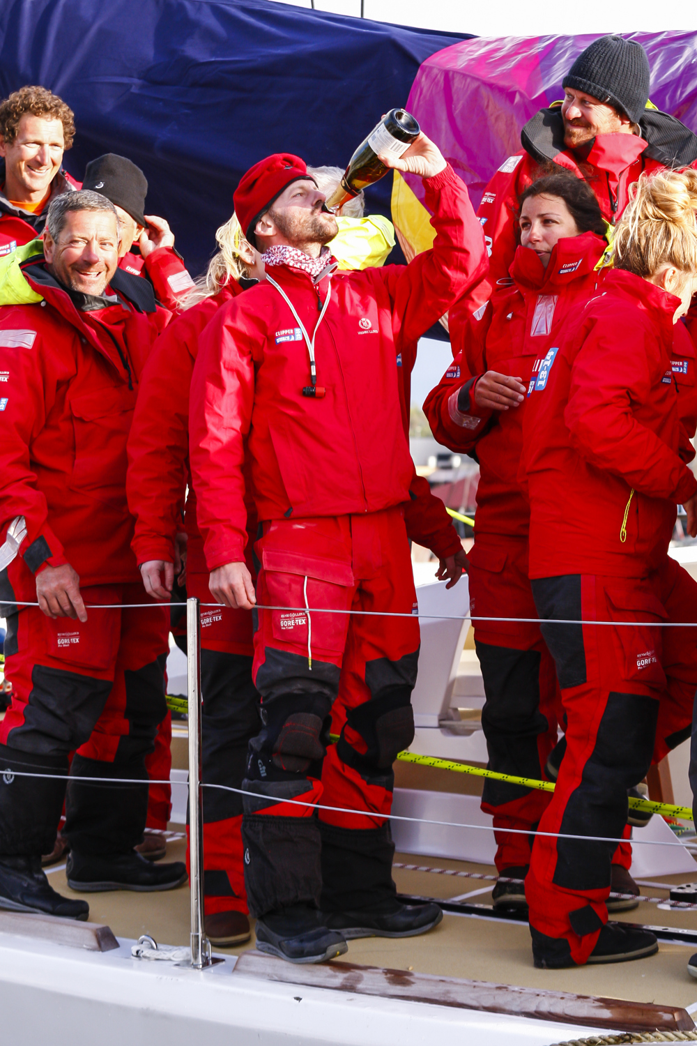 The crew of Derry~Londonderry~Doire celebrate being the first to sail up the Derwent river as a part of the Clipper Round the World race, a category of the Sydney to Hobart yacht race at Constitution Dock in Hobart, Monday, Dec. 30, 2013. (AAP Image/Heath Holden) NO ARCHIVING, EDITORIAL USE ONLY