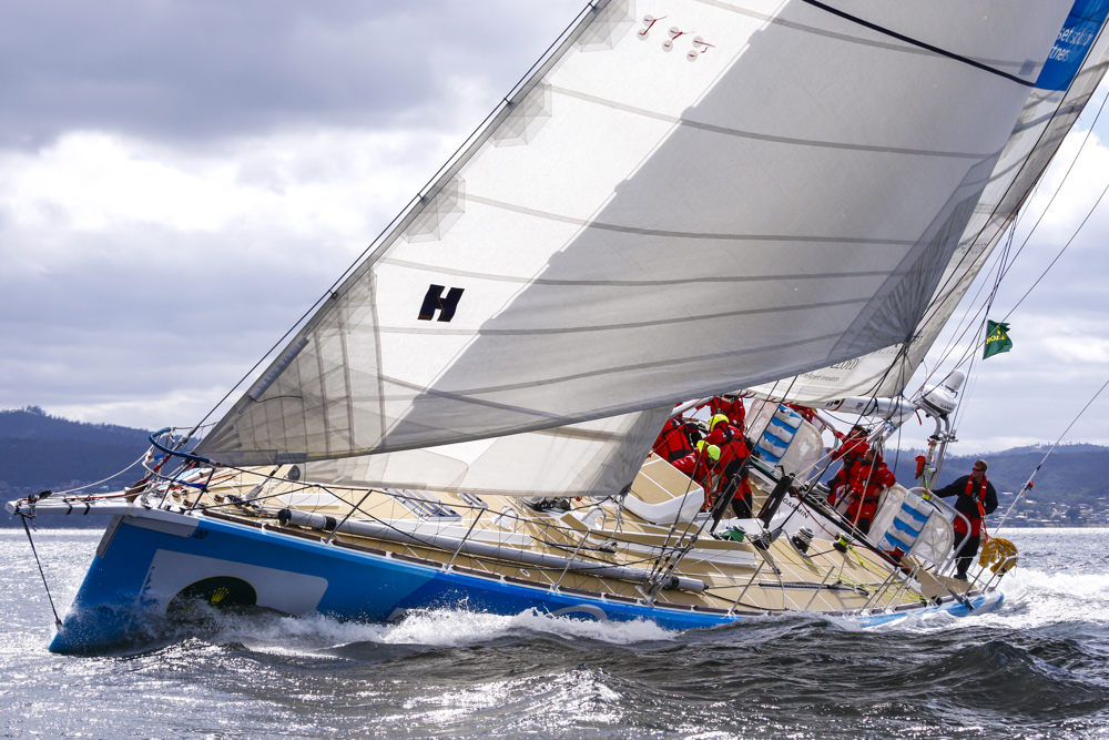 One DLL crew head up the Derwent River towards the line at the end of the Clipper Round the World race, a category of the Sydney to Hobart yacht race at Constitution Dock in Hobart, Monday, Dec. 30, 2013. (AAP Image/Heath Holden) NO ARCHIVING, EDITORIAL USE ONLY