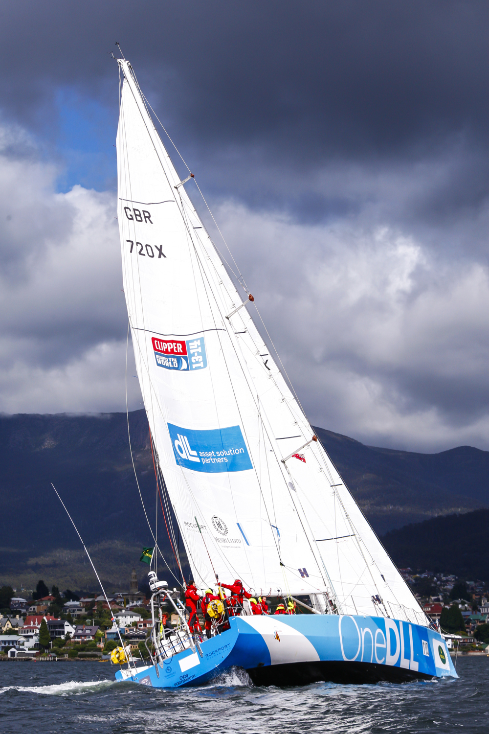 One DLL crew head up the Derwent River towards the line at the end of the Clipper Round the World race, a category of the Sydney to Hobart yacht race at Constitution Dock in Hobart, Monday, Dec. 30, 2013. (AAP Image/Heath Holden) NO ARCHIVING, EDITORIAL USE ONLY