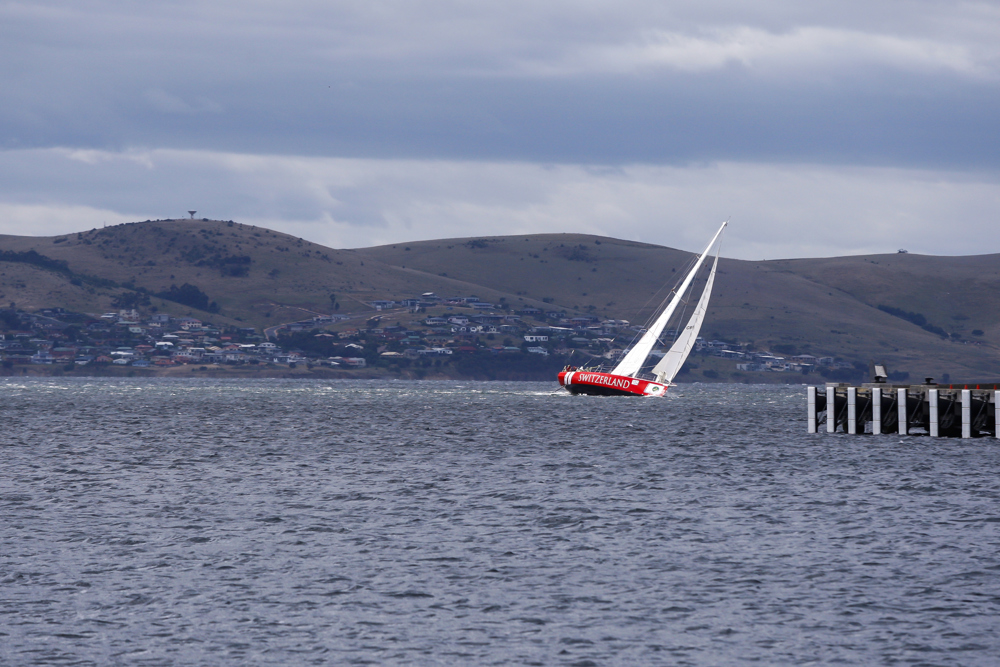 Switzerland crosses the finish line at the end of the Clipper Round the World race, a category of the Sydney to Hobart yacht race at Constitution Dock in Hobart, Monday, Dec. 30, 2013. (AAP Image/Heath Holden) NO ARCHIVING, EDITORIAL USE ONLY