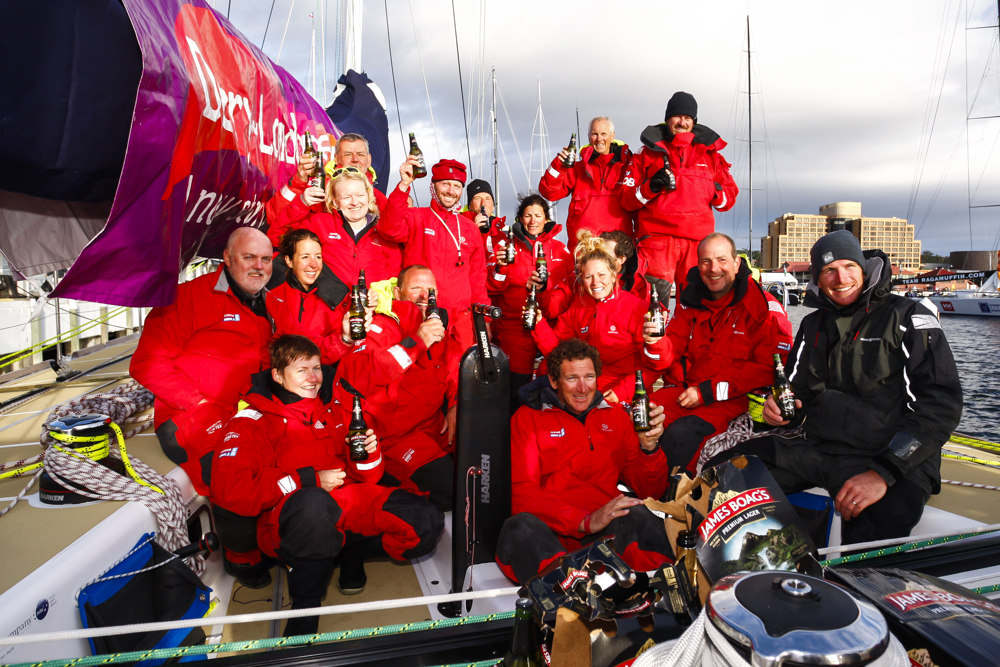 The crew of Derry~Londonderry~Doire celebrate being the first to sail up the Derwent river as a part of the Clipper Round the World race, a category of the Sydney to Hobart yacht race at Constitution Dock in Hobart, Monday, Dec. 30, 2013. (AAP Image/Heath Holden) NO ARCHIVING, EDITORIAL USE ONLY