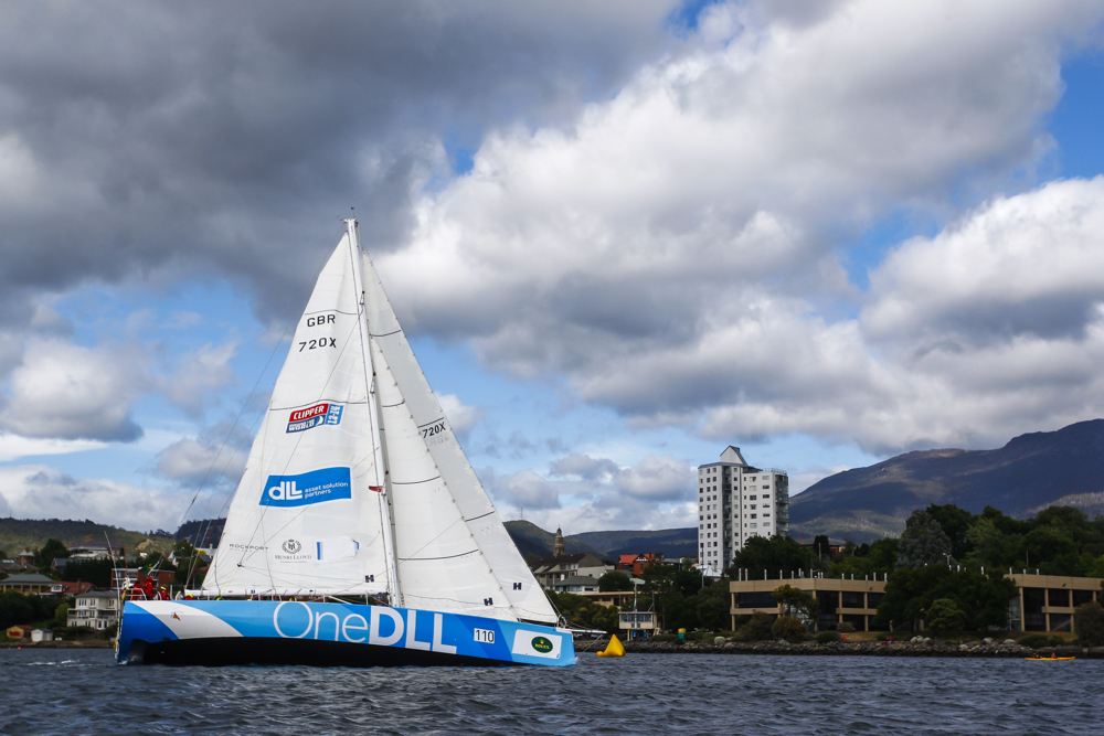 One DLL crew head up the Derwent River towards the line at the end of the Clipper Round the World race, a category of the Sydney to Hobart yacht race at Constitution Dock in Hobart, Monday, Dec. 30, 2013. (AAP Image/Heath Holden) NO ARCHIVING, EDITORIAL USE ONLY