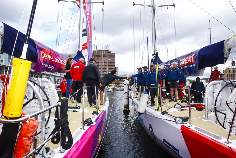 Derry~Londonderry~Doire crew are congratulated by Team Great Britain at constitition dock as a part of the Clipper Round the World race, a category of the Sydney to Hobart yacht race at Constitution Dock in Hobart, Monday, Dec. 30, 2013. (AAP Image/Heath Holden) NO ARCHIVING, EDITORIAL USE ONLY