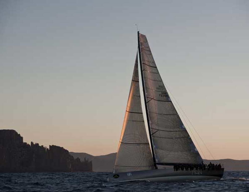 Niklas Zennstrom's JV72 RAN passing Cape Raoul at sunrise