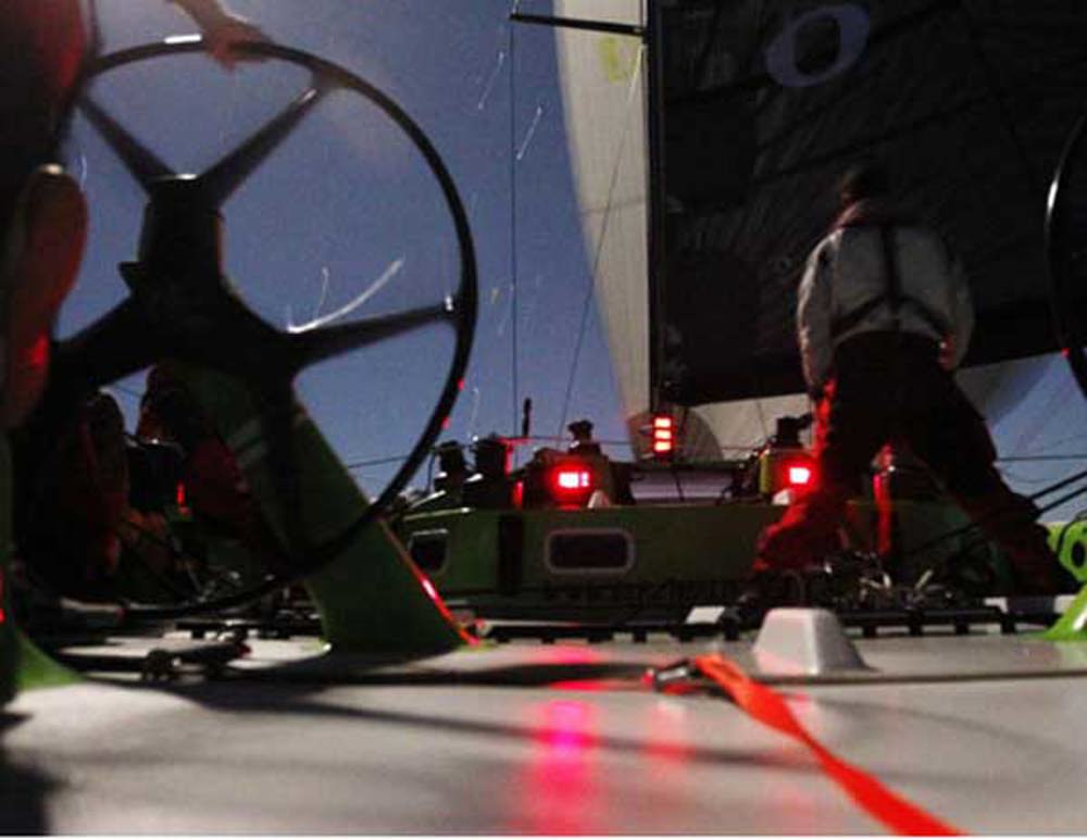 Craig Ellis' Future Shock sailing under a moonlit sky