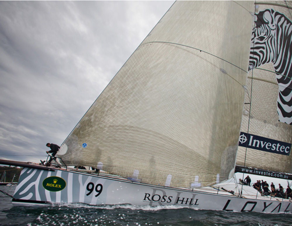 The crew of Investec Loyal going through final preparations 8 minutes before the start