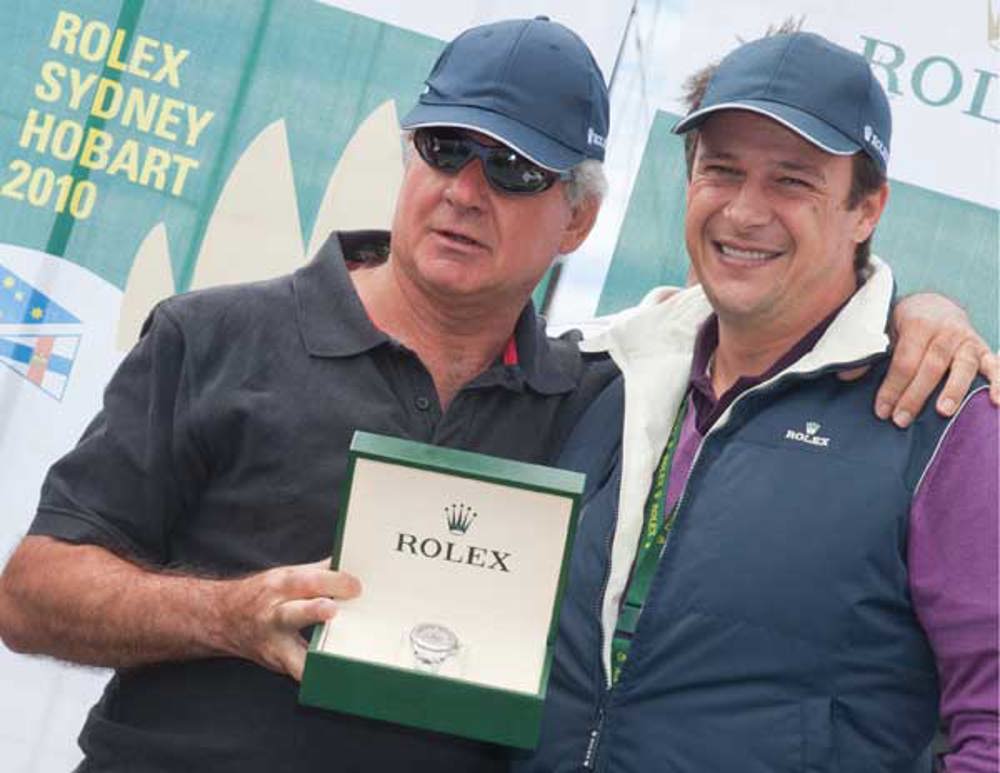 Geoff Boettcher accepts his Rolex Yacht Master timepiece from Patrick Boutellier, Rolex Australia