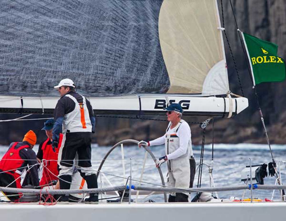 Roger Hickman at the helm of Vamp, passing the Organ Pipes