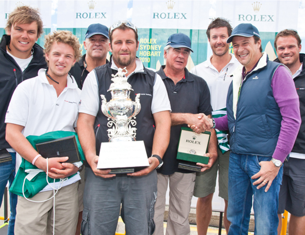 The crew of overall winner Secret Mens Business 3.5 with Rolex Australia General Manager Patrick Boutellier