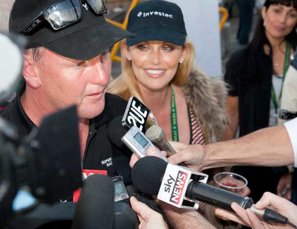 Anthony Bell is joined by wife Kelly Landry dockside as he addresses the media