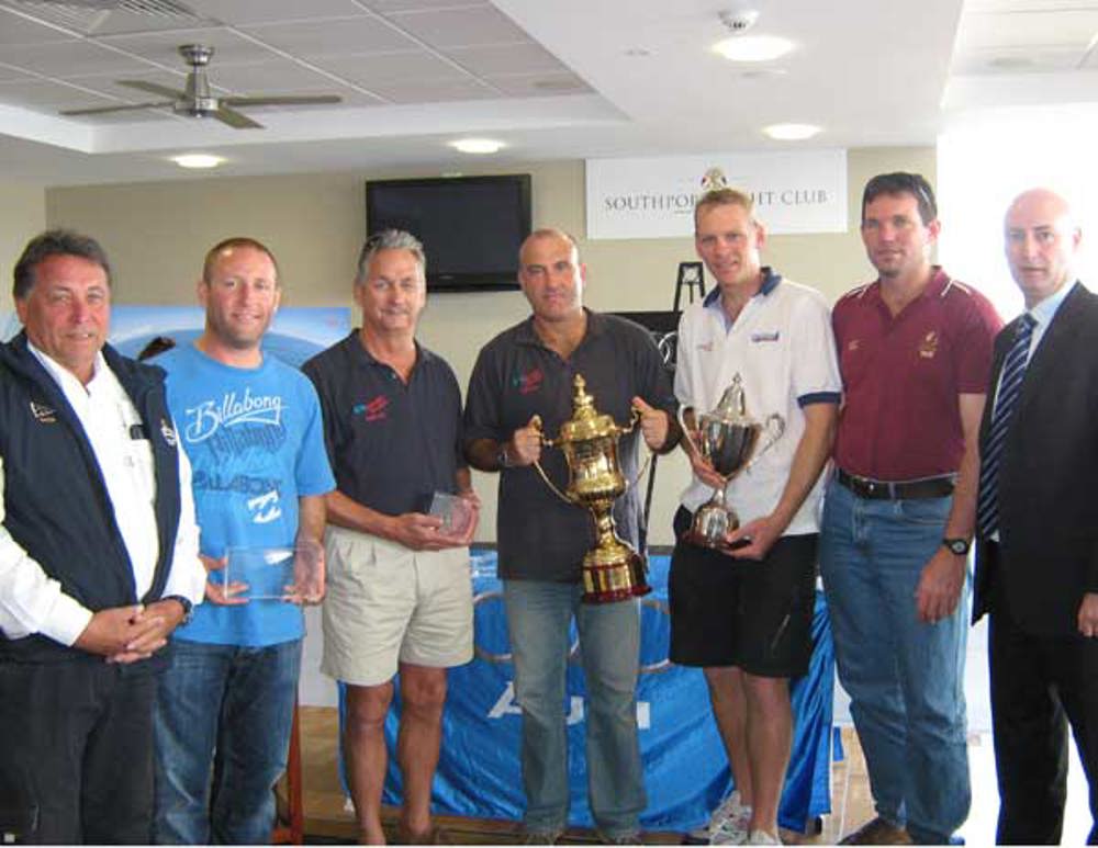 The crew of AFR Midnight Rambler with their trophies for their wins in the Audi Sydney Gold Coast Yacht Race' with Rear Commodore John Cameron (far left) and Simon French, Sales Manager, Audi Centre Gold Coast