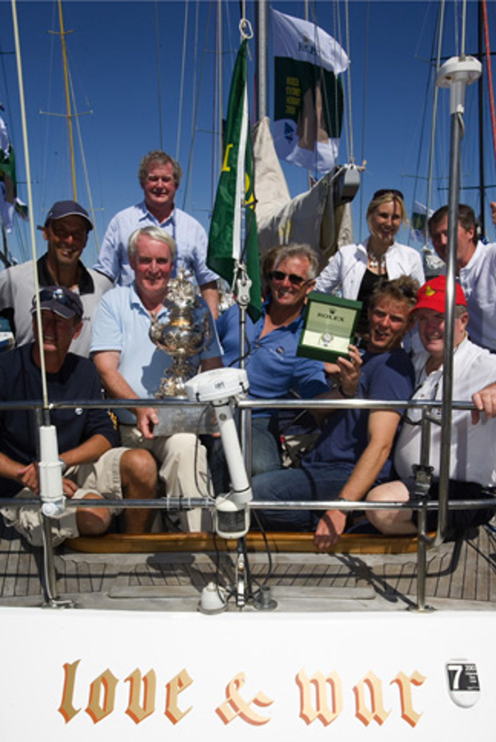 The crew of Love & War with the Tattersalls Cup and Rolex watch