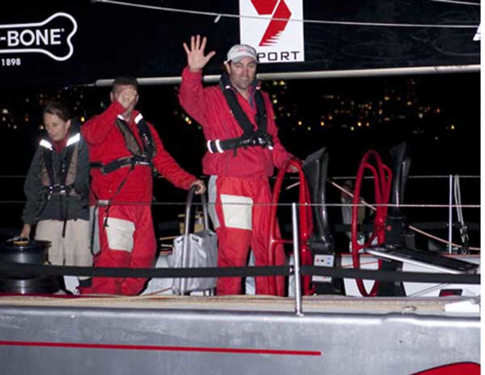 Wild Oats XI skipper Mark Richards jubilant after crossing the finish line and taking the line honours win in the Audi Sydney Gold Coast Yacht Race 2010