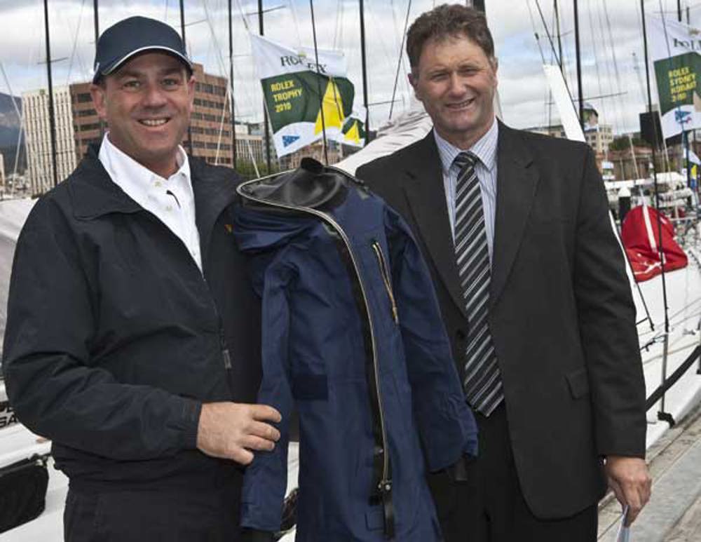Matt Allen, Chairman of CYCA SOLAS Trusts and Brett Smith, Tasmanian Air Rescue Trusts, with one of the immersion suits that the SOLAS Trusts donation funds were used to purchase