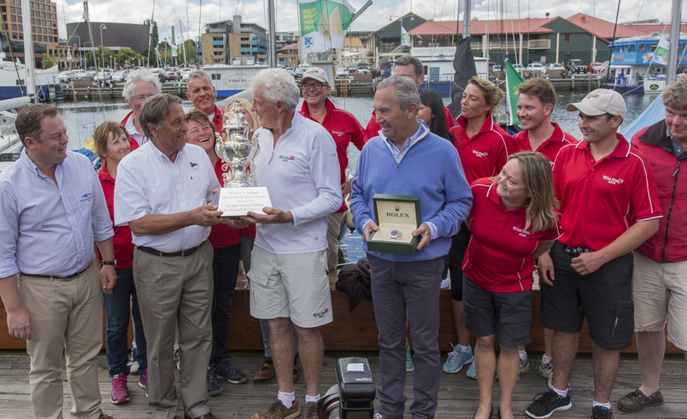 Roger Hickman, Owner Wild Rose, and crew receive the Tattersall's Cup and a Rolex Timepiece.
Front row: Richard Batt,  Commodore Royal Yacht Club of Tasmania, John Cameron, Commodore Cruising Yacht Club of Australia, Roger Hickman, Jean-Nöel Bioul, Rolex SA.