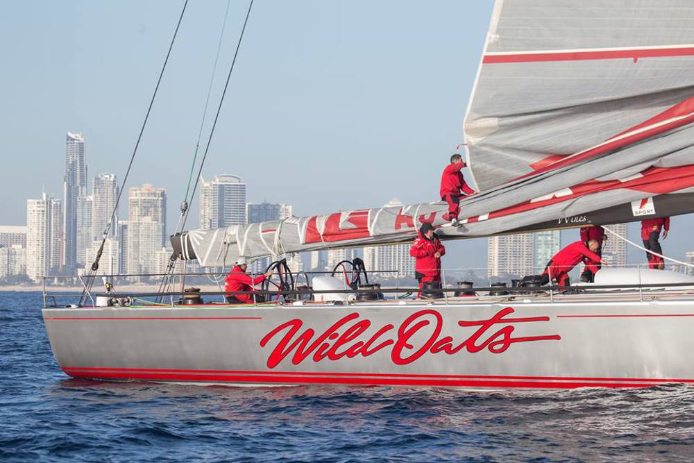 The crew of Wild oats XI flaking the main after finishing