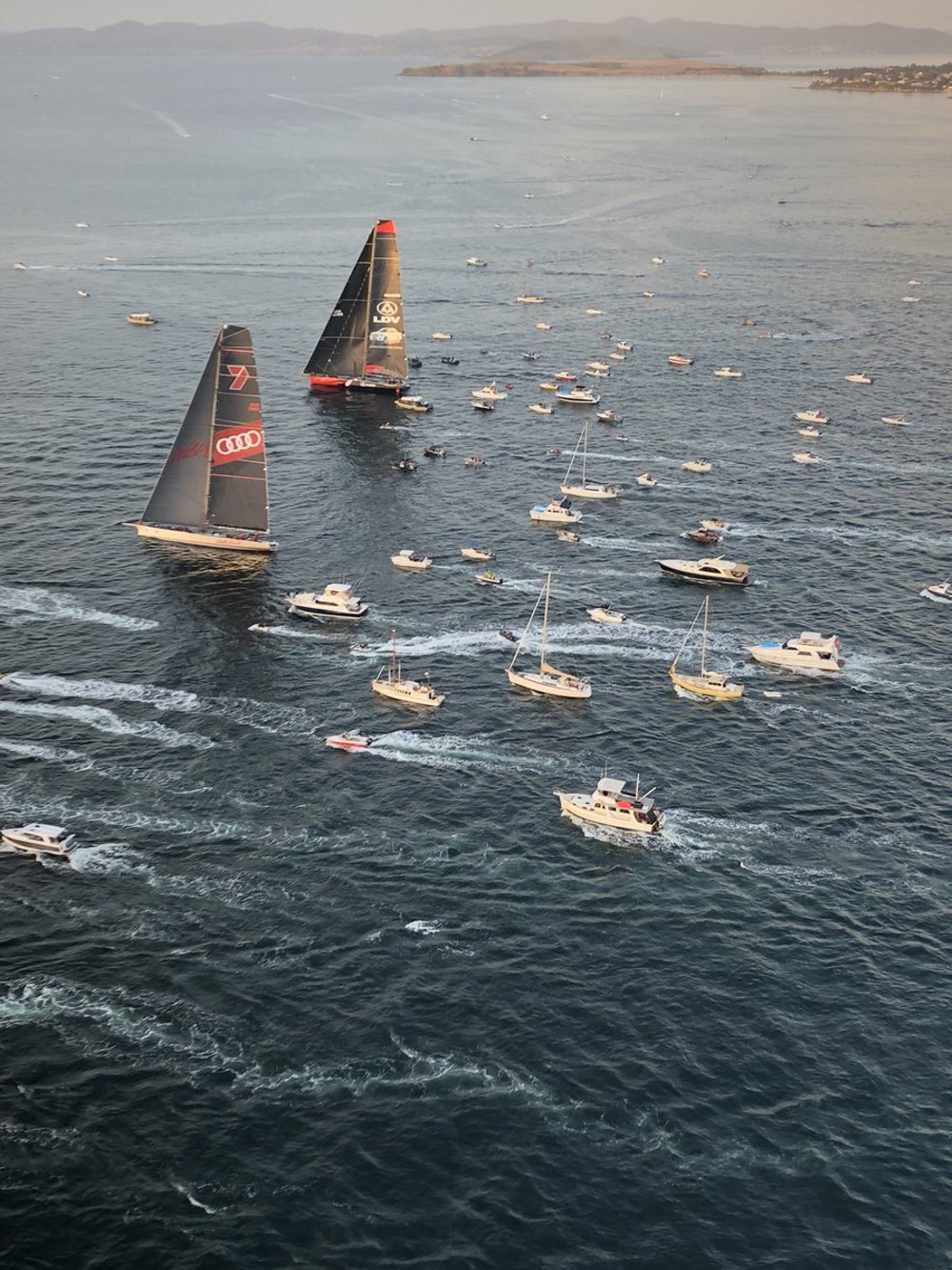 Wild Oats XI and LDV Comanche drifting in the RIver Derwent, less than 10 miles from the finish