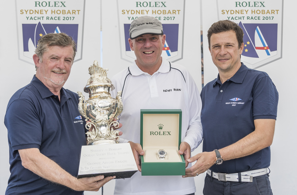 CYCA Commodore John Markos, Ichi Ban skipper Matt Allen and Patrick Boutellier, General Manager of Rolex Australia at the dockside presentation of the Overall Winner trophy and Rolex Timepiece