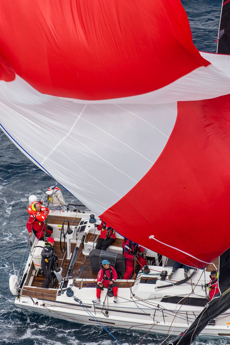 Wings trying to bring an unruly spinnaker under control
