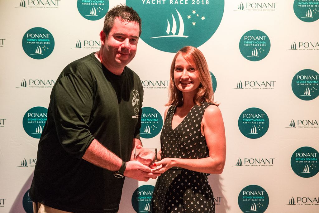IRC Overall winner, first place ORCi and PHS and 3rd over the line - Smuggler skipper Sebastian Bohm with PONANT Marketing Manager, Australasia Eva Robert