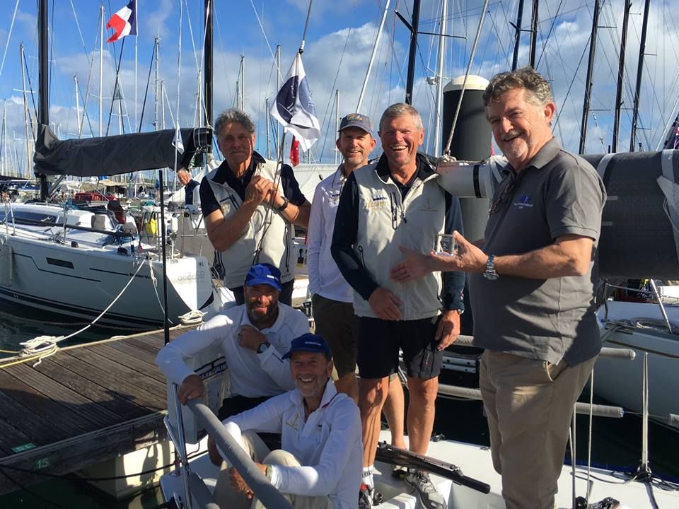 CYCA Commodore John Markos welcoming Shane Kearns and the crew of Komatsu Azzurro in Noumea