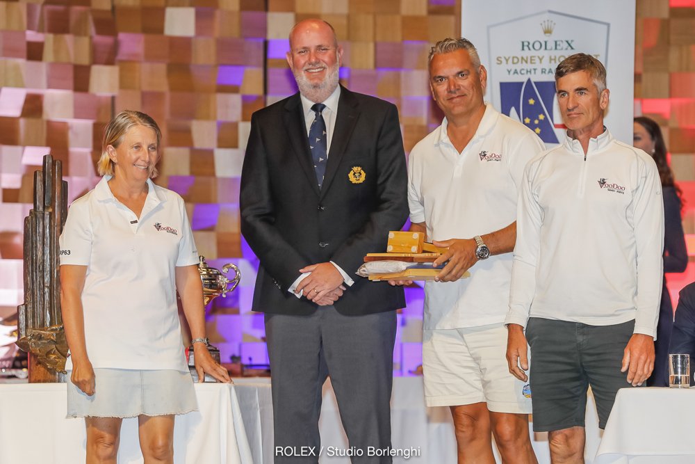 CYCA Commodore Paul Billingham presenting Hugh Ellis’ Voodoo with trophy for 3rd Overall, as well as the TasPorts Trophy for first in ORCi Division 2 and the George Barton Trophy for first in IRC Division 1