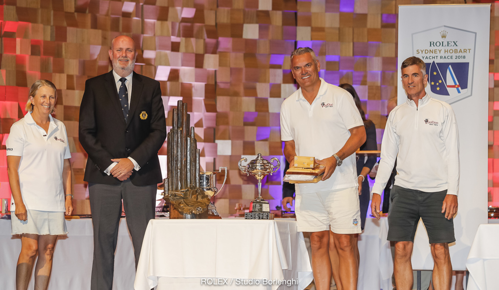 CYCA Commodore Paul Billingham presenting Hugh Ellis’ Voodoo with trophy for 3rd Overall, as well as the TasPorts Trophy for first in ORCi Division 2 and the George Barton Trophy for first in IRC Division 1