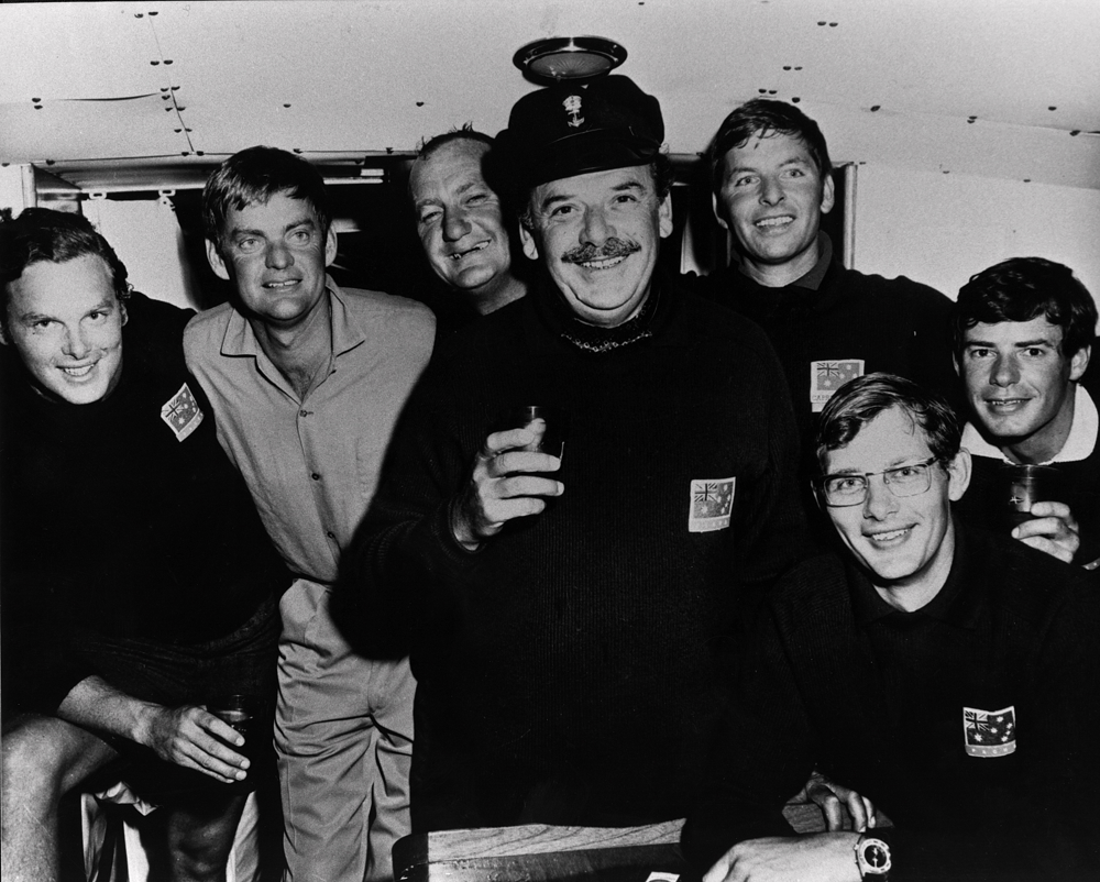 1970 Sydney Hobart Pacha crew.  L to R: Anthony Crichton-Brown, Mark Tostevin, Colin Burnell, Robert Crichton-Brown, John Wigan, Gruce Gould, Graeme Ewing. Missing from picture: Stan Darling (Navigator), Peter Green (Sailing Master), Bill Bold.