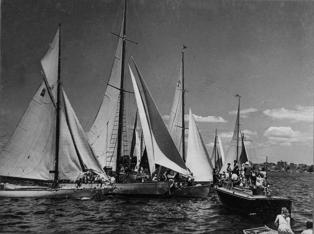 Collision at the start of the 1947 Sydney Hobart Race. Pictured are Defiance (windward yacht at left), Morna (in the sandwich)  and Christina. Christina protested Morna for barging, but lost, and both Defiance and Christina were disqualified. Photo borrowed from Josephine Blumberg, grand-daughter of Charlie Cooper. Caption reads" 'Start 3rd Sydney-Hobartr Race 1947, 'Morna' fouling 'Christina'