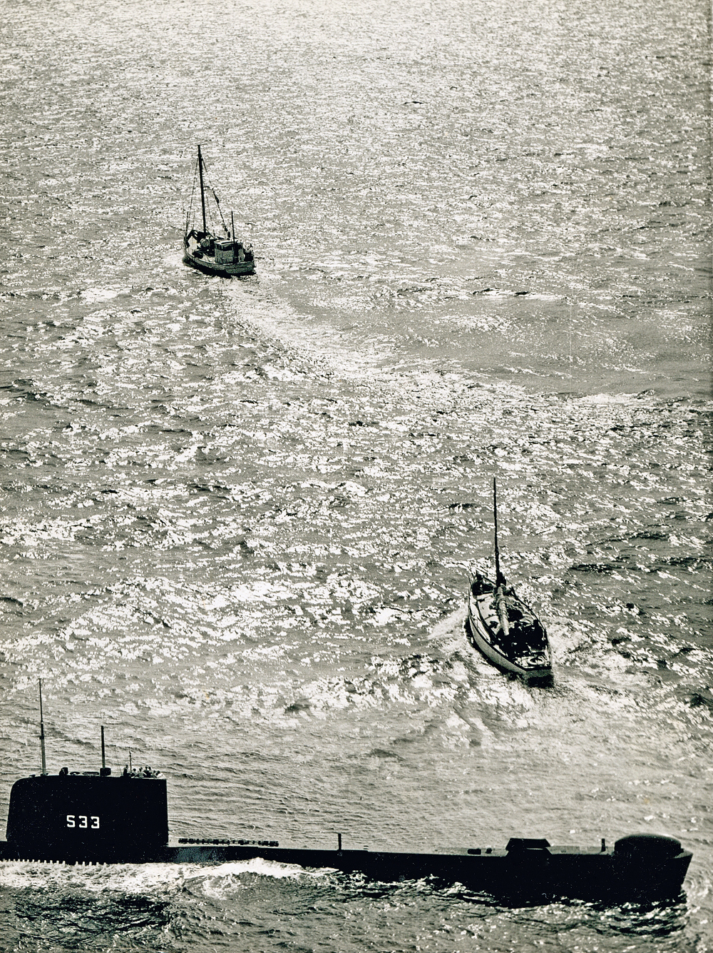 Lolita's tow being assumed by a fishing trawler, after initially being towed by HMS Trump