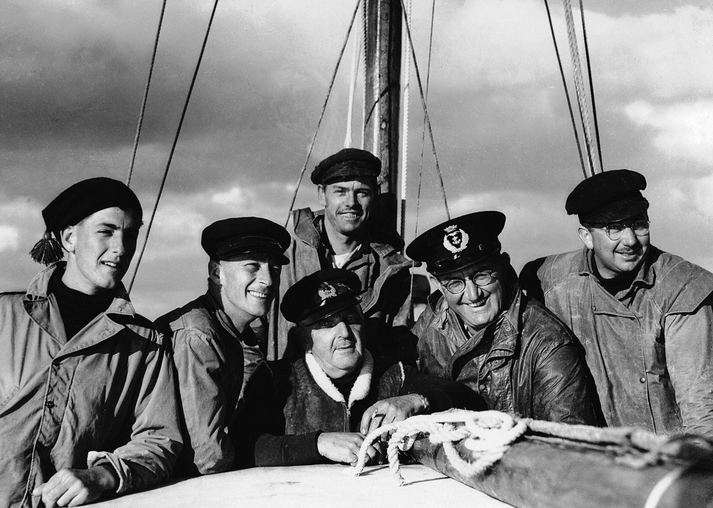 Wayfarer crew in the 1945 Sydney Hobart race.  L to R: Geoff Ruggles, Len Wilsford, Brigadier Arthur Mills, Peter Luke (at rear),  Bill Lieberman, Fred Harris