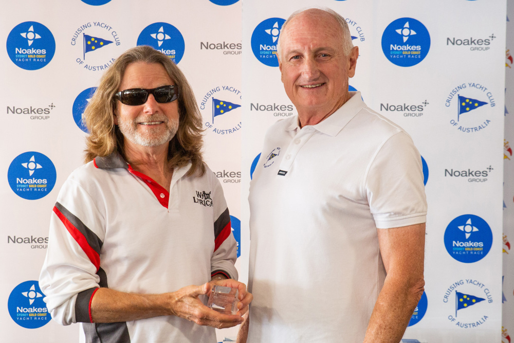 Noel Cornish presenting PHS Corinthian 3rd place trophy to Les Goodridge, skipper of Wax Lyrical