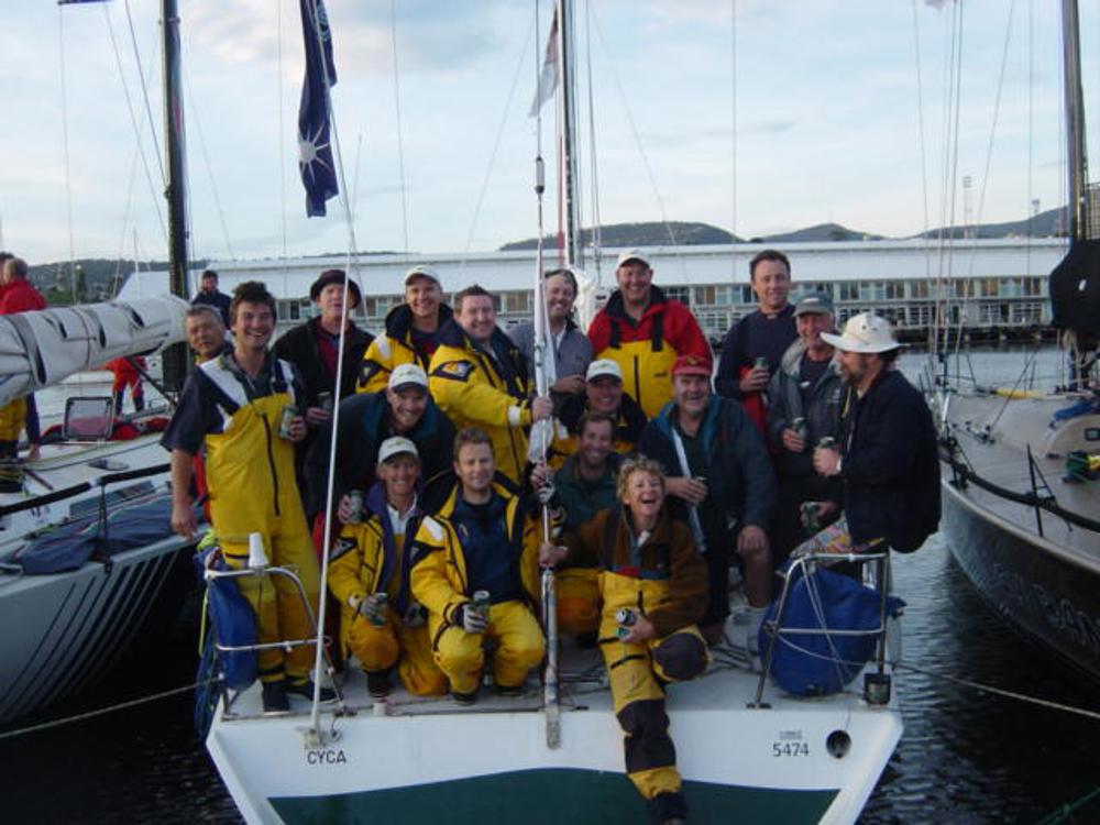 Infinity III crew in Constitution Dock after 2002 Sydney Hobart - (l to r from front)  Pip Lavis, Les Goodridge, Louise Stevenson, Pete newell, Federico Pogliano, Geoff Lavis, Peter Bush, Ian Potter, Adam Kilkeary, Andrew Smith, Tim Molchanoff, Bruce Morrow, Martin James, Fred Etter, Chris Flanagan, Roger Howlett, Brett Smith