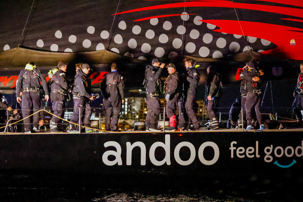 Andoo Comanche crew celebrate just after crossing the finish line