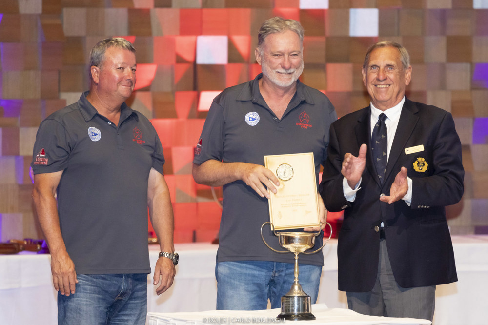 Andrew Nuttman and Anthony Kirke (owners/skippers, Enterprise Next Generation) collect the Seamanship Award from Arthur Lane (Commodore, CYCA).