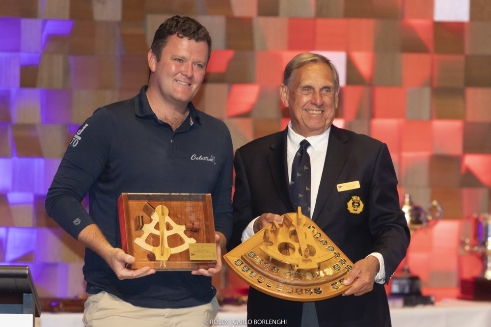 James Dagge (navigator, Celestial) is presented the Bill Owen Memorial Trophy by Arthur Lane (Commodore, CYCA).