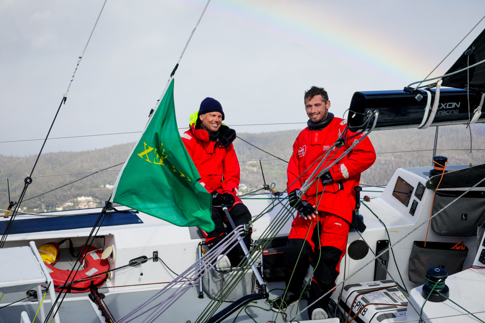 Rupert Henry (L) and Jack Bouttell (R), co-skippers of Mistral, approaching the finish line