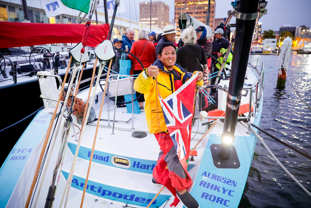 Antipodes tied up and crew ready to celebrate