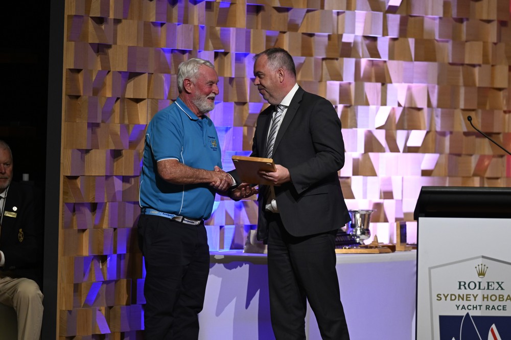 Lindsay May being presented with his '50 Race' medallion by Minister Nic Street, in his case for 50 consecutive races.
