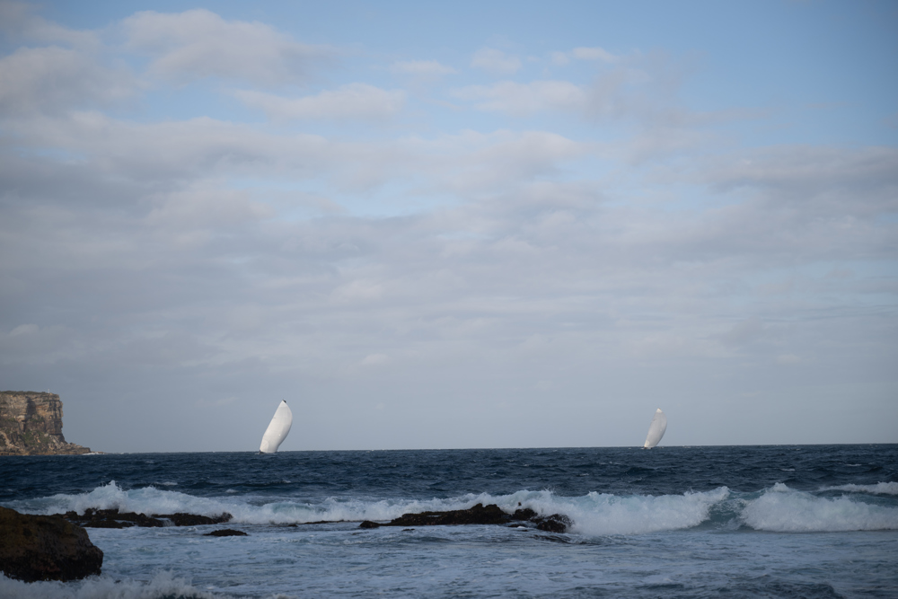 Reichel Pugh 63 No Limit passing through Sydney Heads, pursued by Caro.   Image: CYCA | Vito Feremans